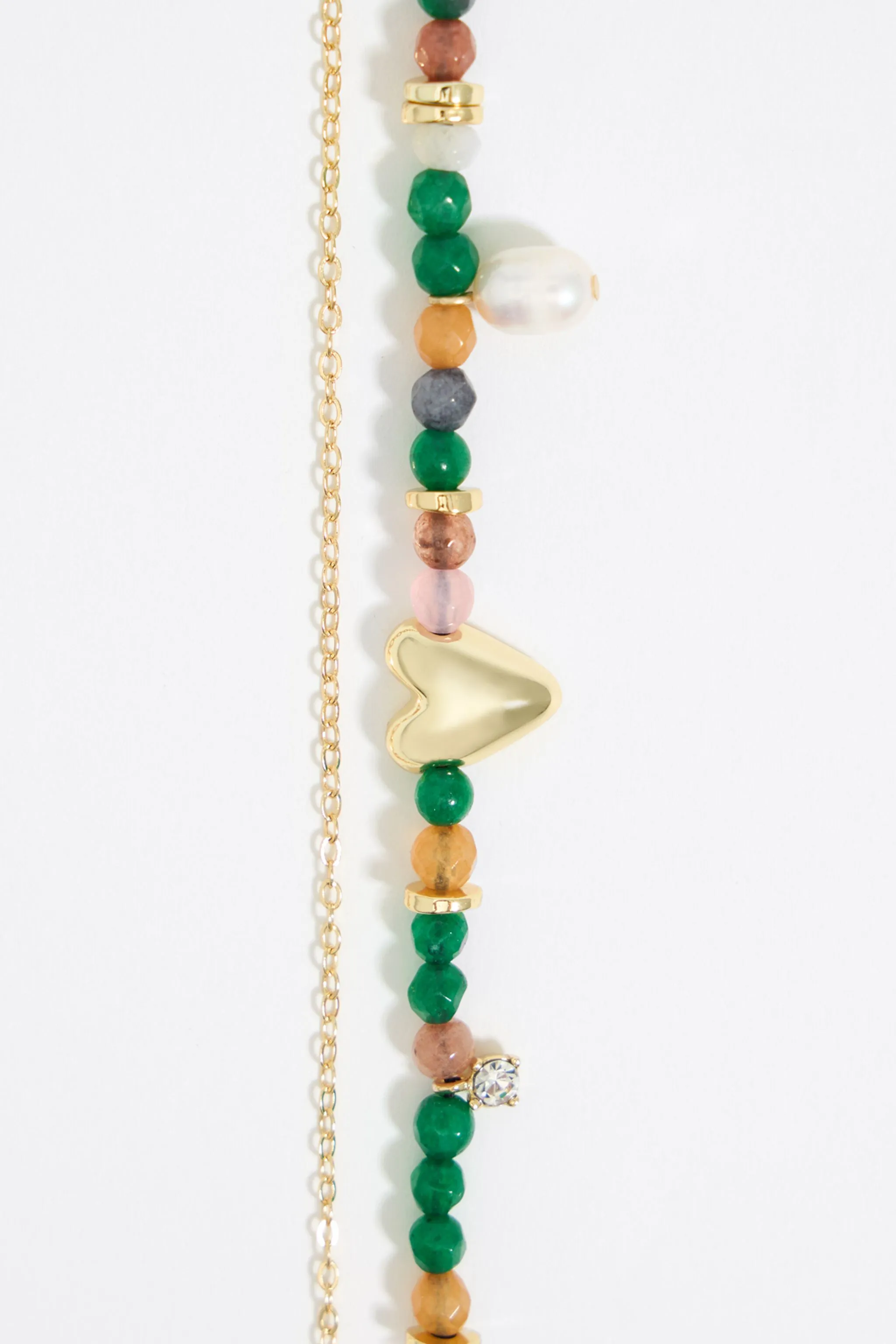 Collar piedras verdes y corazón dorado