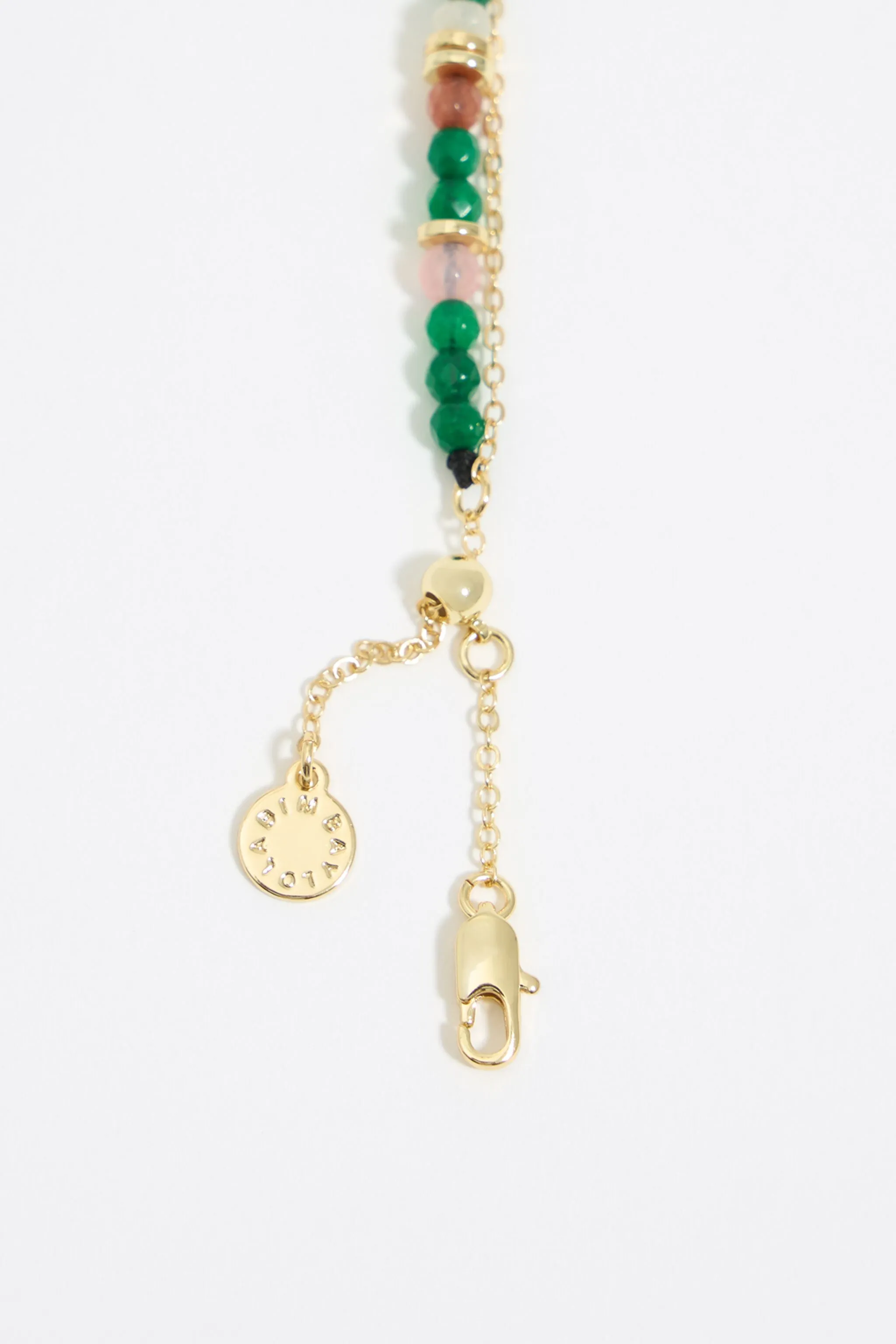 Collar piedras verdes y corazón dorado